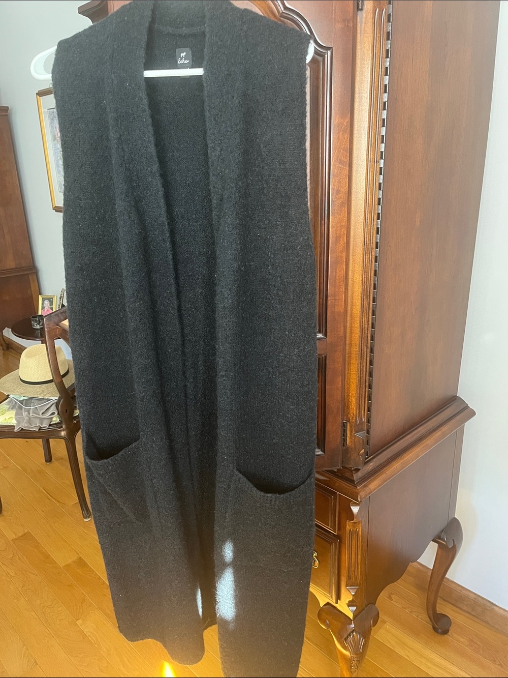 Echo boiled wool long sleeveless open vest with no buttons. A great layered look